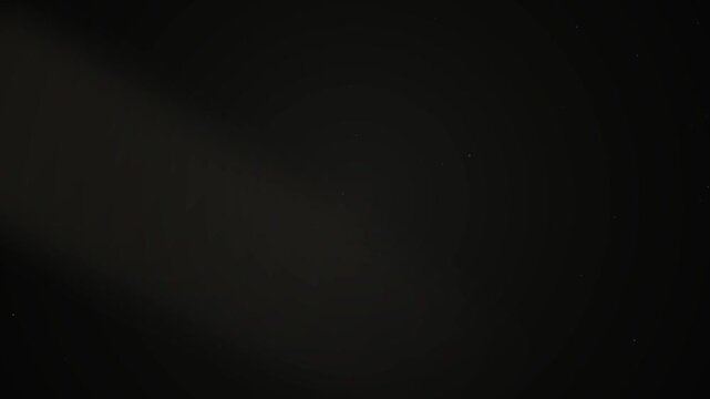 Premium 10-second seamless loop of a cinematic dark room with volumetric light beams, atmospheric fog, and floating 3D dust parallax. Ideal for luxury backgrounds, sci-fi environments, and documentary