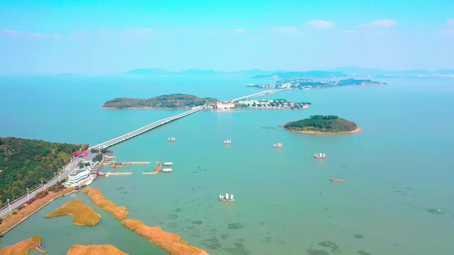 Aerial View of Long Bridge Crossing Lake with Islands and Wetlands in Lake Tai, Jiangsu, China