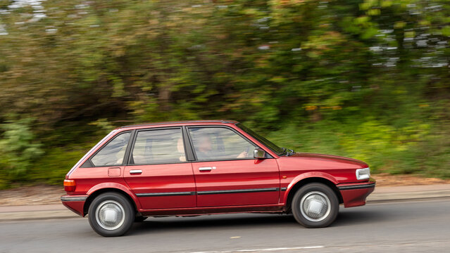 Milton Keynes; UK - Sept. 27th 2026: 1985 red Austin Maestro Vanden Plas  classic car driving on a British road