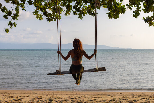 travel to Thailand, woman tourist on beach swing, freedom and inspiration