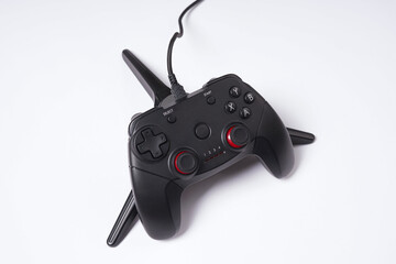 Black Console Style Game Controller on White Background © AndhikaRaya