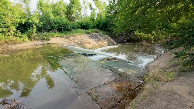 A check dam in the forest that was damaged by flash floods and heavy rainfall.