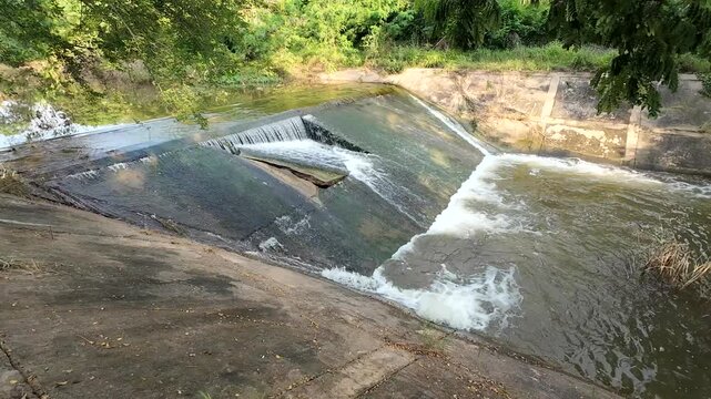 A check dam in the forest that was damaged by flash floods and heavy rainfall.