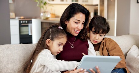 Fototapeta premium Mother, children and play in living room with tablet, bonding together and video game for knowledge. Happy, woman and kids in family home with tech, entertainment and online gaming for education.