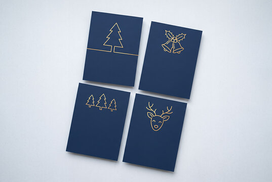 Navy blue greeting cards with gold line Christmas icons and copy space