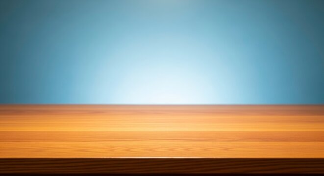 Close up of warm wooden planks table surface with smooth texture and soft blue gradient background