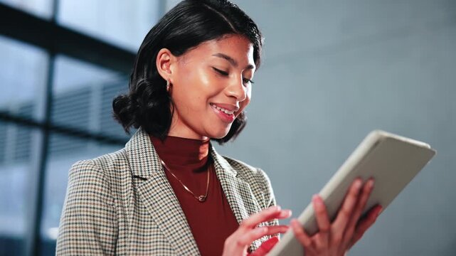 Woman, lawyer and review in office with tablet, email witness and new evidence for court case. Smile, attorney and reading at law firm with tech, upcoming trial and testimony for proceedings verdict