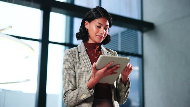 Woman, lawyer and reading in office with tablet, email witness and new evidence for court case. Smile, attorney and review at law firm with tech, upcoming trial and testimony for proceedings verdict