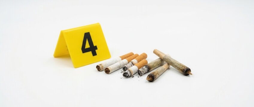 Crime Scene Evidence Cigarette Butts and Numbered Marker on White Background