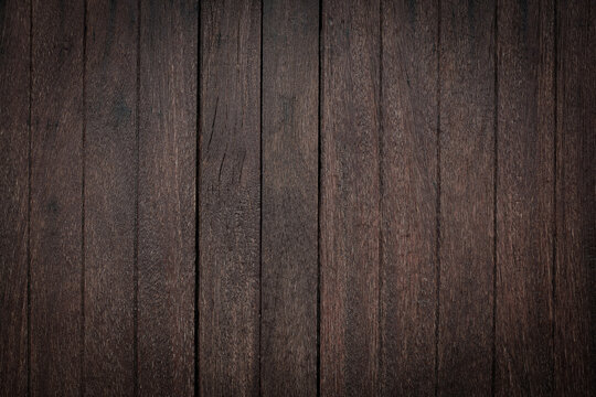 Dark brown wooden planks texture surface background for design backdrop.