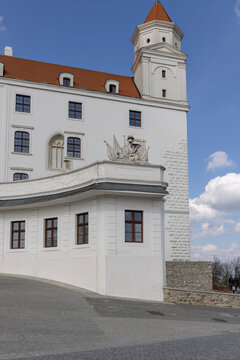 Stone military trophy sculpture with armor and flags on Baroque balustrade at Bratislava Castle, Bratislava, Slovakia
