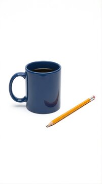 Dark blue ceramic coffee mug with black coffee and yellow pencil isolated on white background