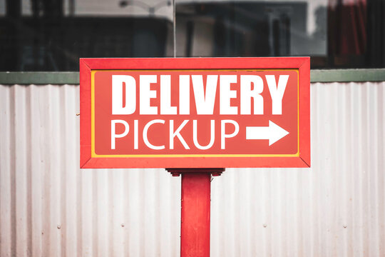 Delivery pickup sign with arrow