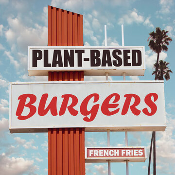 Plant-based burgers sign with palm trees