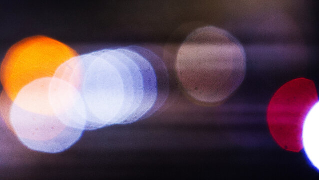Defocused background of a cityscape at night. Abstract background with bokeh and lights
