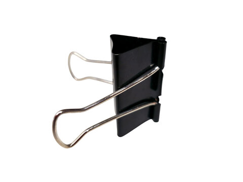 Black binder clip standing on a clean white surface