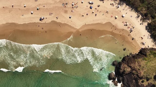 Top down drone footage of surf and sand patterns at Dreamtime Beach, Tweed Coast, NSW Australia