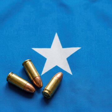 Bullets on Somalia Flag Background Symbolizing Conflict and Violence in Somalia