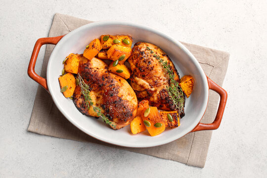 Autumn meal: roasted chicken and pumpkin with herbs