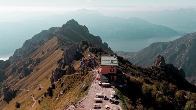 Aerial view of the rosalba refuge on the grignetta mountain, with a breathtaking panoramic view over lake como and the surrounding peaks