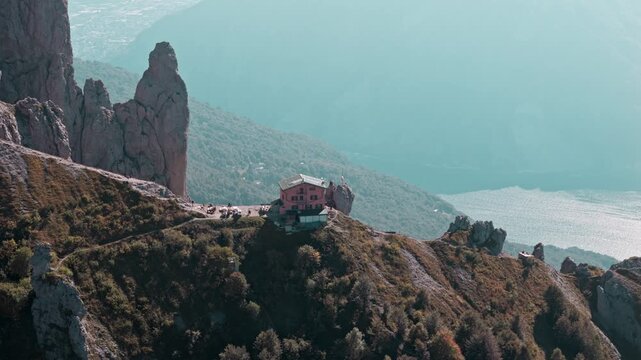 Majestic aerial view showcasing the rifugio rosalba mountain hut perched on the grigna meridionale with lake como in the background