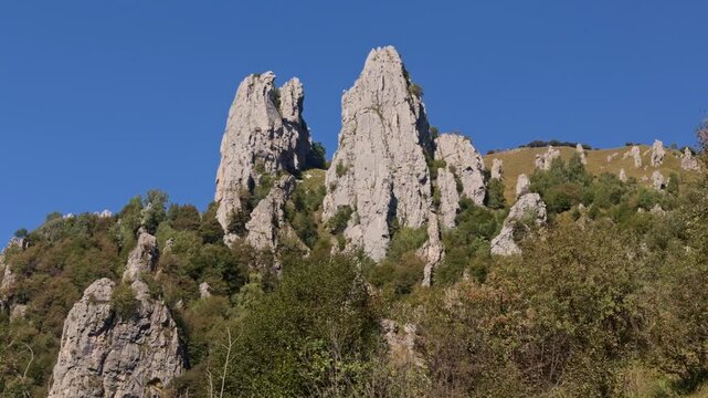 Stunning rocky peaks of sasso cavallo and sasso carbonari against a clear blue sky. This beautiful mountain landscape is in mandello del lario