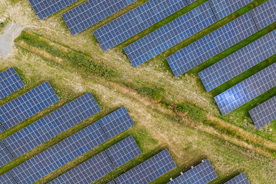 Aerial top down view of a large solar panel farm
