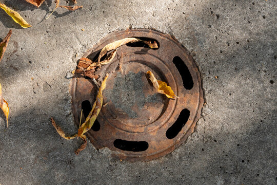 Street drain on road, rainwater drainage