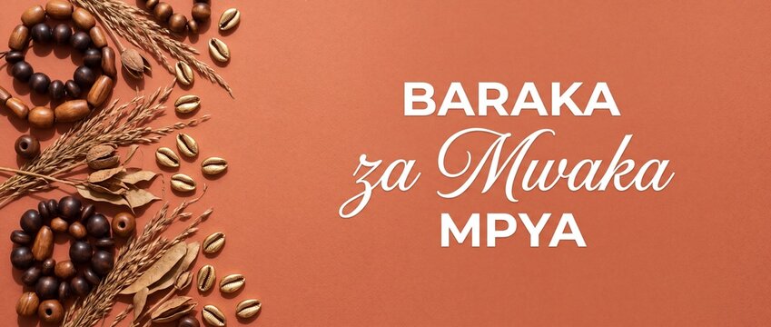 Swahili African New Year background with golden cowrie shells, wooden beads, and dried wheat flat lay on terracotta paper with Baraka za Mwaka Mpya text for festive holiday banner design.