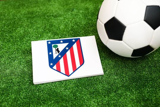 A football on the grass and the Atletico Madrid Football Club logo. September 30, 2026.