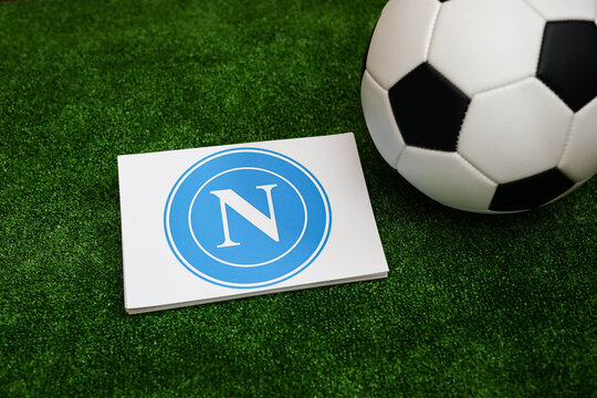A football on the grass and the Napoli Football Club logo. September 30, 2026.