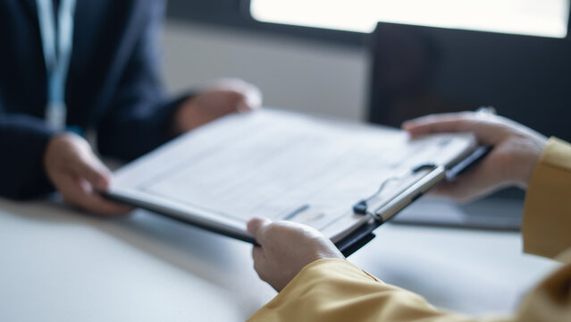 Business people hold a resume and talk to job applicants for job interviews about careers and Their personal history in the company. Recruitment concepts
