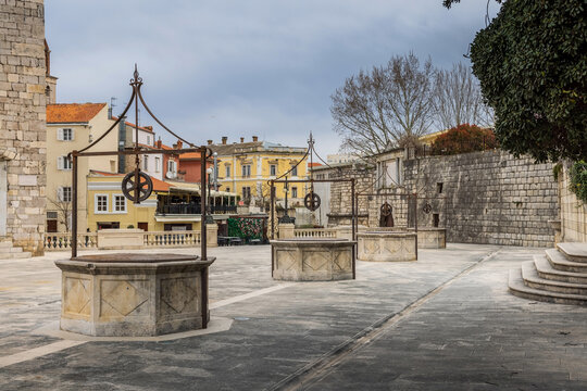 Scenic outdoor view of the historic Renaissance wellheads lined up at the Five Wells Square in Zadar Croatia.