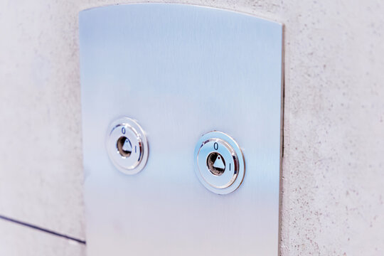 Fireman's switch on a brushed metal control panel, providing essential fire safety and emergency control in buildings