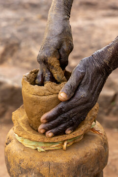Hands shaping a clay pot, Kabye mount, Togo
