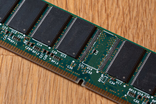 Green computer memory module RAM stick with 1 missing chip. Random Access Memory (RAM), a crucial component for a computer's performance