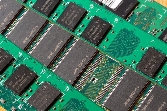 Green computer memory module RAM sticks with 1 missing chip. Random Access Memory (RAM), a crucial component for a computer's performance