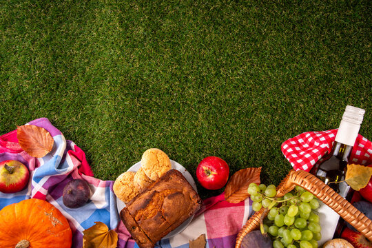 Autumn Thanksgiving holiday picnic basket on g