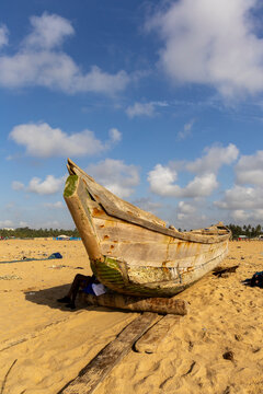 Wooden fishing boat resting on the beach, Lome, Togo