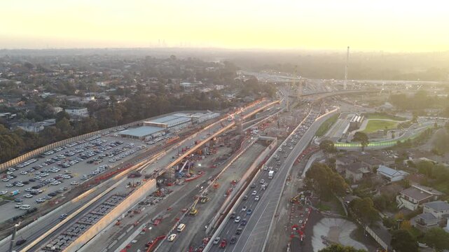 Aerial drone footage of major EastLink freeway construction in Melbourne, Australia, showing live traffic, roadworks, heavy vehicles and large-scale transport infrastructure upgrades.