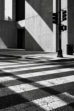 Monochrome Urban Crosswalk with Modern Concrete Architecture
