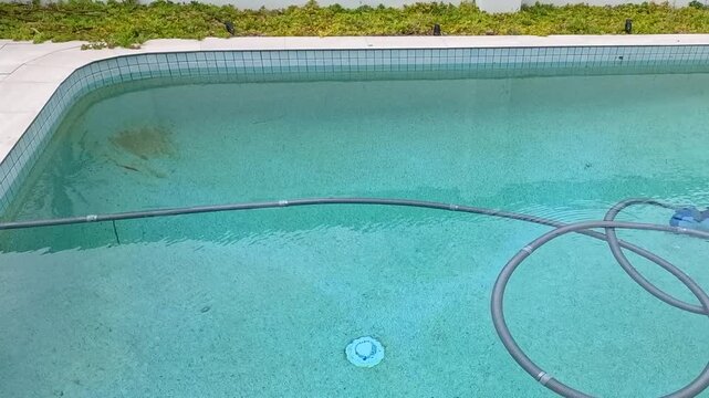 Time Lapse of Automatic Pool Cleaner Vacuuming Backyard Swimming Pool