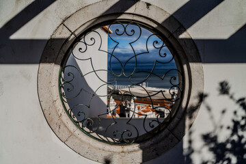 Obraz premium Dramatic cityscape of Lisbon's historic district showing a white domed church (National.