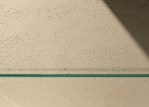 Product presentation scene made with empty glass shelf on travertine textured beige wall