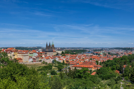 The cityscape of Prague shows historic architecture from above