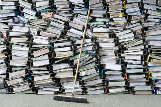 Pile of office files, broom