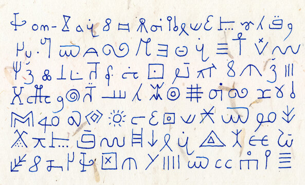 Blue indecipherable asemic characters are written on old parchment