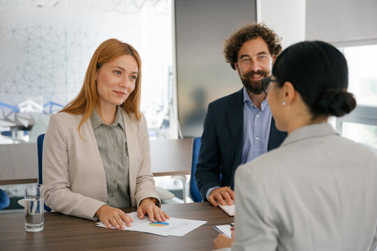 Businesswoman in modern office having interview with experts