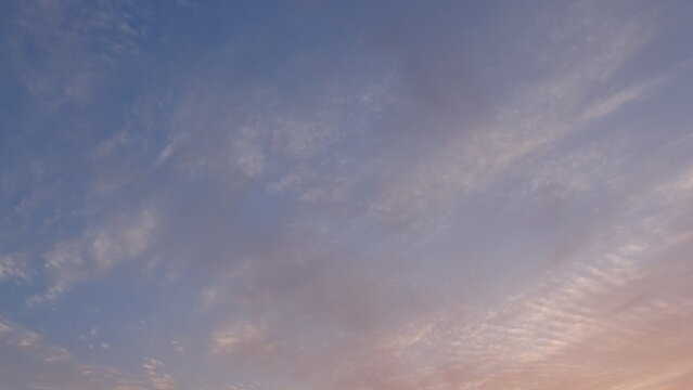 Clear morning sky with gentle sunrise gradients.
A clear morning sky with soft clouds showing gentle gradients of sunrise light breaking through the atmosphere.