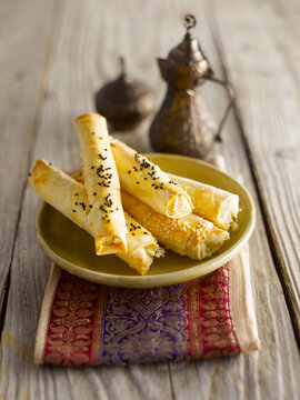 Traditional Turkish sigara borek pastry on a plate indoors